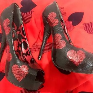Iron Fist Black Heels with Red Heart Accents